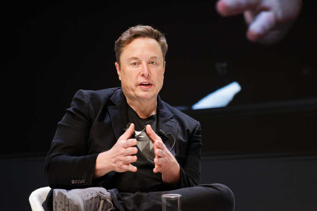 Image Source: Chief Technology Officer of X Elon Musk speaks onstage during the 