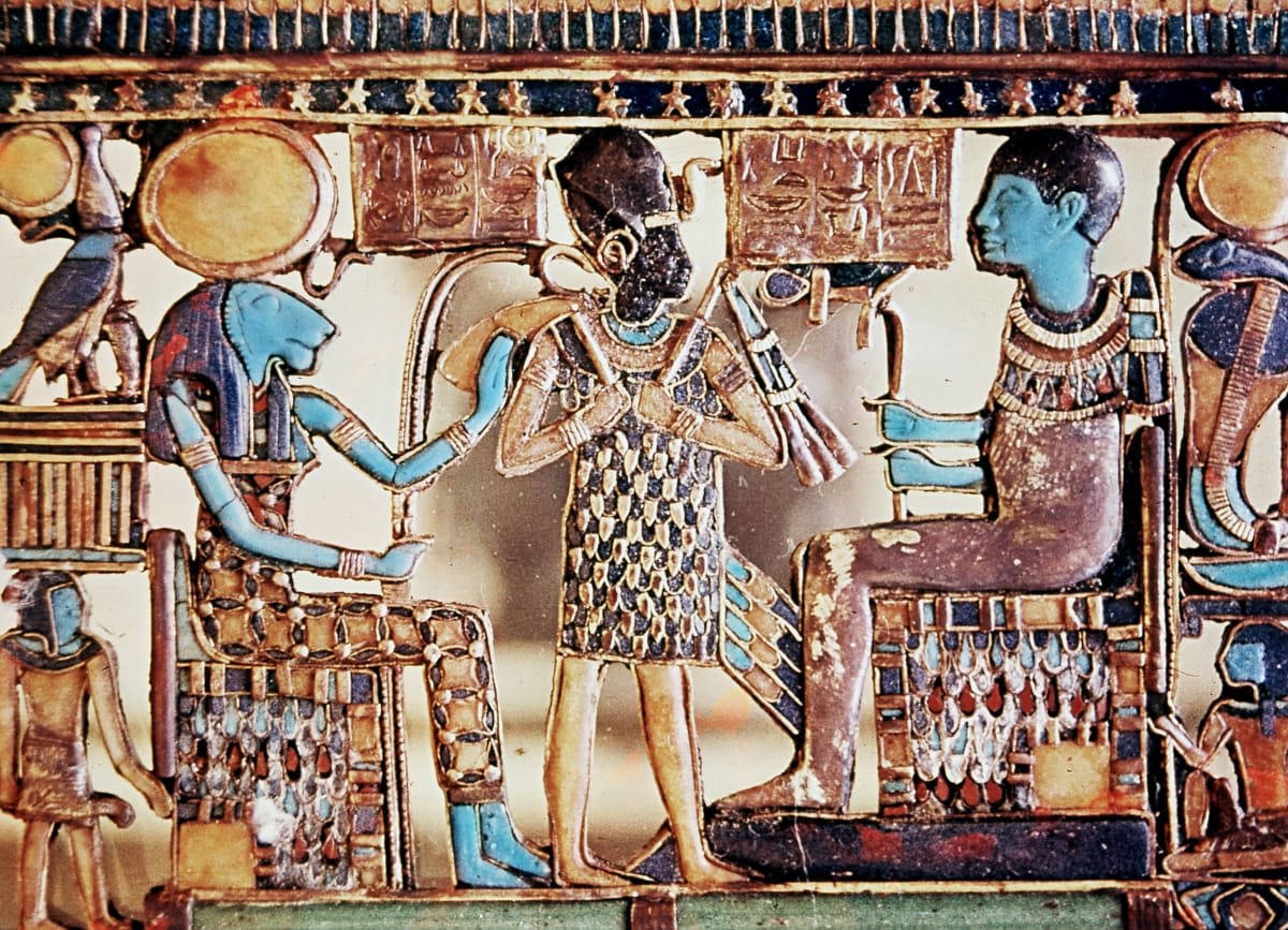 Image Source: Pectoral jewel from the tomb of Tutankhamun, showing Ptah, and his consort, Sekhmet, lion-headed goddess of war. (Photo by Ann Ronan Pictures/Print Collector/Getty Images)