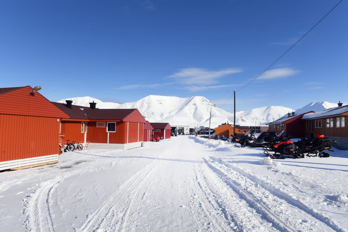 Image Source: The main street in Longyearbyen on April 21, 2022 in Svalbard, Norway. (Photo by Rune Hellestad- Corbis/ Corbis via Getty Images)