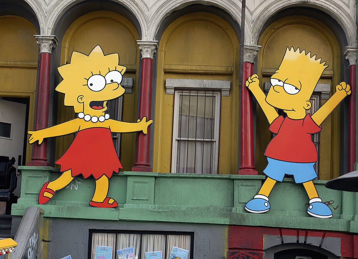 LOS ANGELES, CA - APRIL 25: Lisa Simpson and Bart Simpson cut-outs on display at 