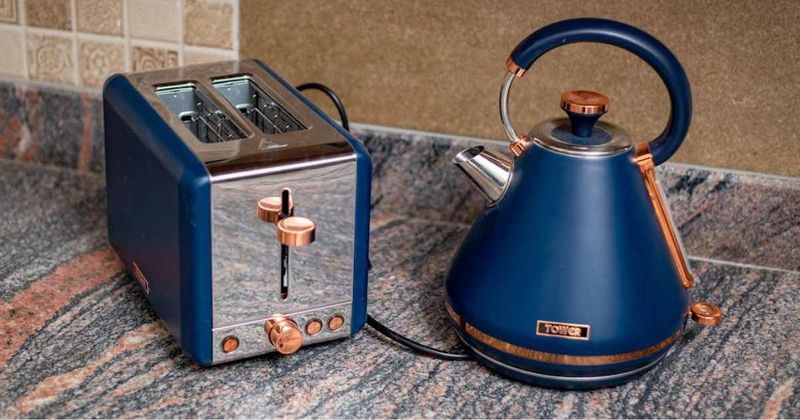 Friends failing to control laughter while arranging funeral for 'favorite kitchen appliance' is epic