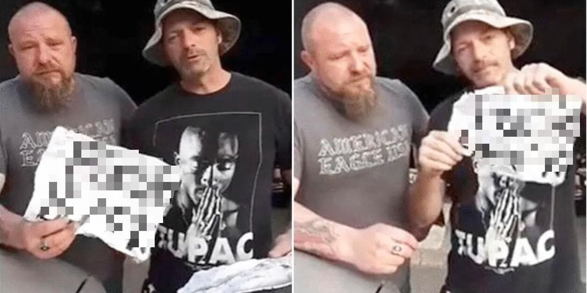 These two white 'working guys' holding racist signs is not at all what you're expecting